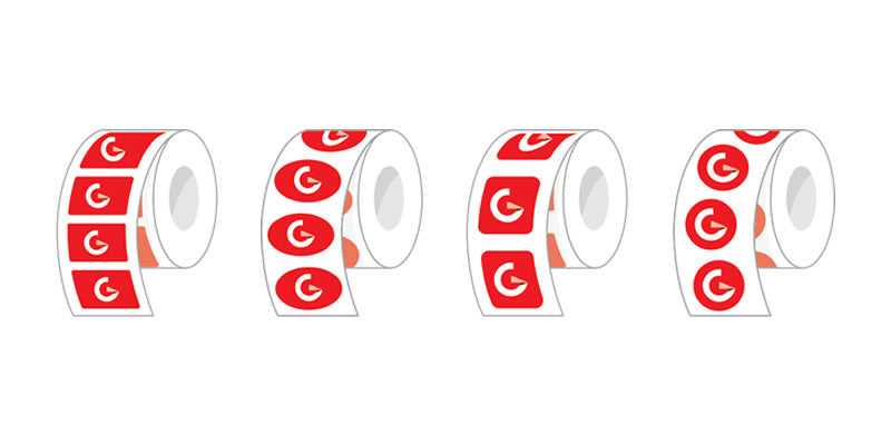Rolls of stickers with red and white design on a white background